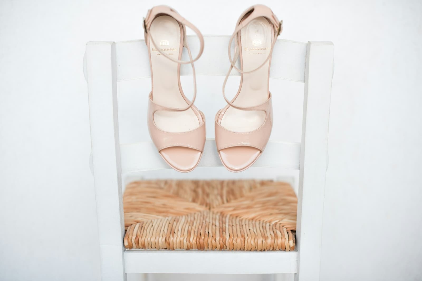 Strappy cream heels on cream linen.